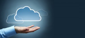 hand with a digital cloud above it representing cloud services