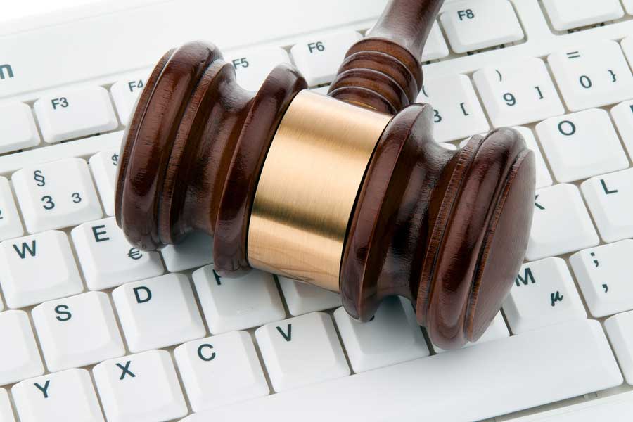 Gavel on top of a keyboard, representing IT computer services for legal offices